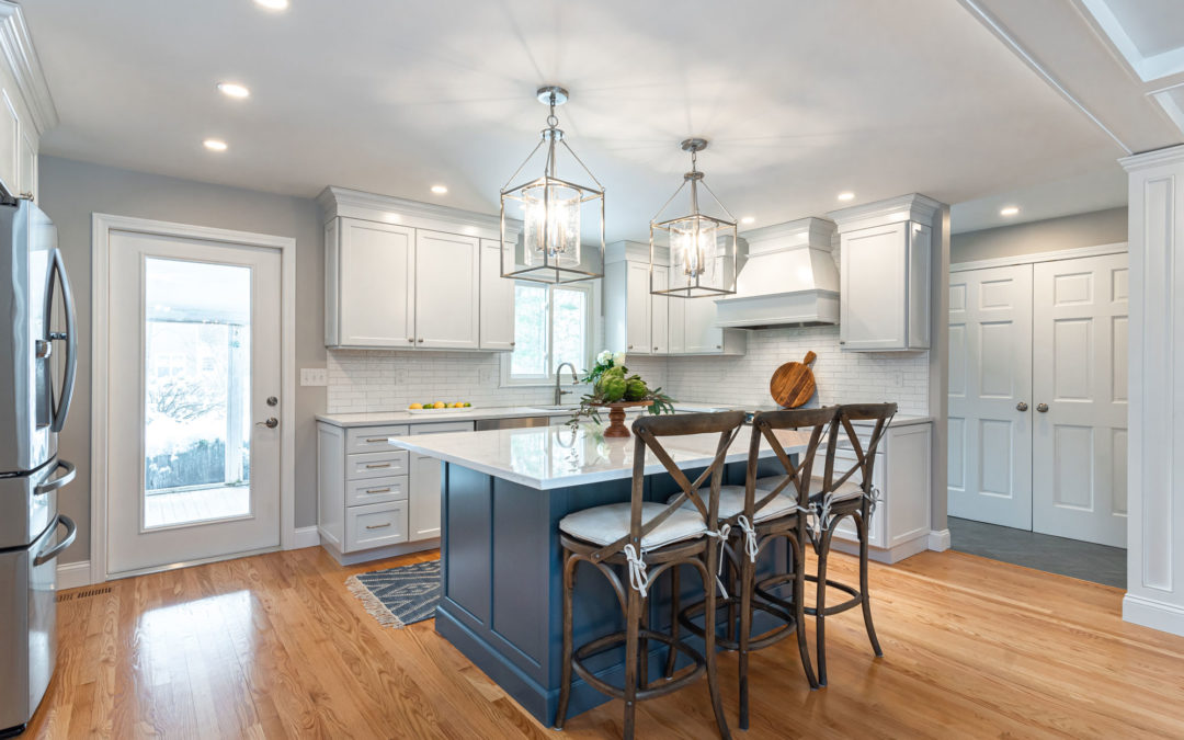 White Kitchen Cabinetry with Blue Island Accent