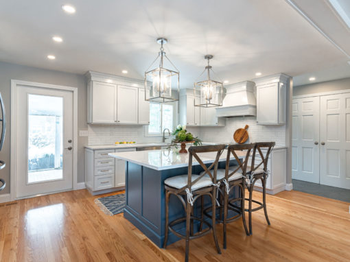 White Kitchen Cabinetry with Blue Island Accent