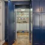 Doors open up to a pass-through pantry!